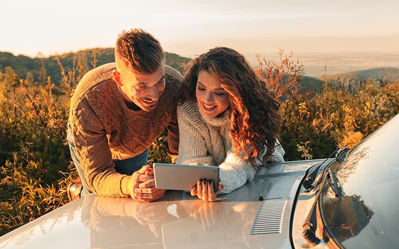 A boy and girl looking at tablet